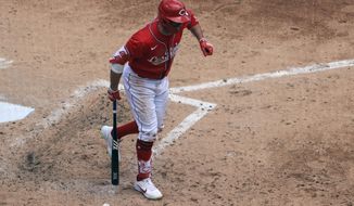 Cincinnati Reds&#39; Joey Votto reacts after being hit by a pitch during the fourth inning of a baseball game against the Chicago White Sox in Cincinnati, Wednesday, May 5, 2021. (AP Photo/Aaron Doster)