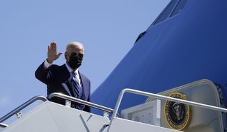 President Joe Biden waves as he boards Air Force One upon departure, Thursday, May 6, 2021, at Andrews Air Force Base, Md. Biden is en route to Louisiana. (AP Photo/Alex Brandon)