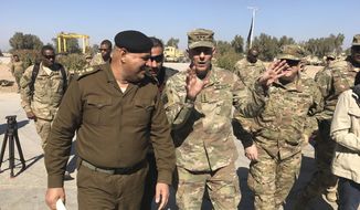In this Feb. 8, 2017, file photo, then-Army Lt. Gen. Stephen Townsend talks with an Iraqi officer during a tour north of Baghdad, Iraq. Townsend, now a general, says a growing military threat from China may well come from Americas east, as Beijing looks to establish a large navy port capable of hosting submarines or aircraft carriers on the Atlantic coast of Africa.(AP Photo/ Ali Abdul Hassan, File)