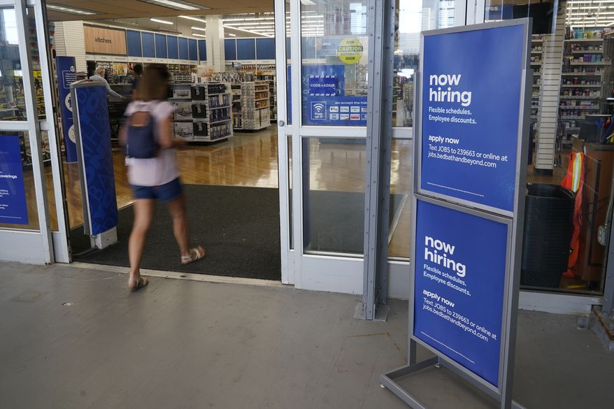 A sign looking to hire employees is displayed at the entrance to a Bed, Bath and Beyond store, Tuesday, May 4, 2021, in Miami. (AP Photo/Marta Lavandier) ** FILE **