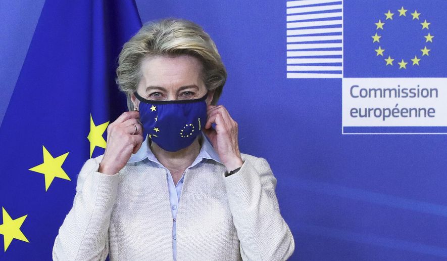European Commission President Ursula von der Leyen removes her protective face mask prior to meeting with Jordan&#39;s King Abdullah II at EU headquarters in Brussels, Wednesday, May 5, 2021. (Yves Herman, Pool via AP) ** FILE **