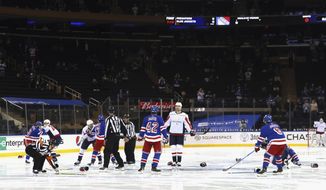 Washington Capitals and New York Rangers fight in the opening seconds of an NHL hockey game Wednesday, May 5, 2021, in New York. (Bruce Bennett/Pool Photo via AP)