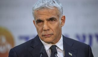 REPLACES COMMON GOOD INSTEAD OF COMMON GROUND -  Israeli opposition leader Yair Lapid, speaks during a news conference in Tel Aviv, Thursday, May. 6, 2021. Lapid called on his potential partners to find &amp;quot;common good&amp;quot; and expressed optimism that a new coalition government would be formed. (AP Photo/Oded Balilty)
