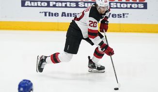 New Jersey Devils&#39; Michael McLeod (20) looks to pass the puck during the second period of the team&#39;s NHL hockey game against the New York Islanders on Thursday, May 6, 2021, in Uniondale, N.Y. (AP Photo/Frank Franklin II)