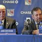 FILE - John Davidson, left, and James Dolan, owner of the New York Rangers, participate in a news conference in New York, in this Wednesday, May 22, 2019, file photo. The New York Rangers have been fined $250,000 by the NHL for “demeaning” public comments about head of player safety George Parros. Owner James Dolan on Wednesday, May 5, 2021, fired team president John Davidson and general manager Jeff Gorton with three games left in the season and turned those jobs over to former assistant Chris Drury. (AP Photo/Seth Wenig, File)