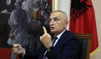 Albanian President Ilir Meta speaks during an interview with the Associated Press in Tirana, Albania, Wednesday, April 21, 2021. Albania’s president waded deep into the country&#x27;s parliamentary election campaign Wednesday, accusing the left-wing government of running a “kleptocratic regime” and bungling its pandemic response. In an interview with The Associated Press, Ilir Meta also said he would step down if Prime Minister Edi Rama&#x27;s Socialists — who are leading the main opposition conservatives in opinion polls — win Sunday&#x27;s vote. (AP Photo/Hektor Pustina)