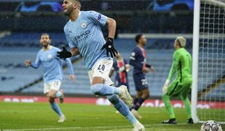 Manchester City&#39;s Riyad Mahrez celebrates after scoring his sides second goal during the Champions League semifinal second leg soccer match between Manchester City and Paris Saint Germain at the Etihad stadium, in Manchester, Tuesday, May 4, 2021. (AP Photo/Dave Thompson)
