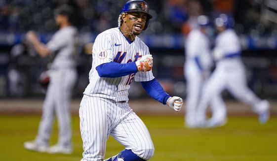 New York Mets&#39; Francisco Lindor runs the bases after hitting a two-run home run off Arizona Diamondbacks relief pitcher Caleb Smith during the seventh inning of a baseball game, Friday, May 7, 2021, in New York. (AP Photo/John Minchillo)
