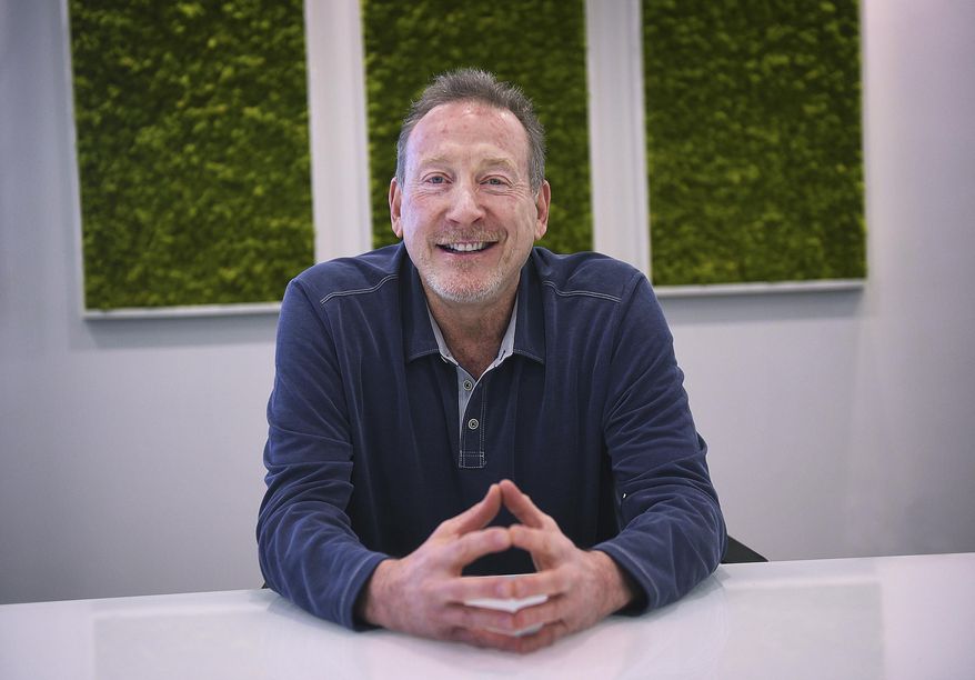 Jeffrey Berns, founder and CEO of Blockchains, poses for a portrait at their corporate headquarters east of Reno on March 2, 2021 in, Nev. A former school teacher has sued Berns, the CEO of a major cryptocurrency company that wants to build a smart city in the Nevada desert. She's accusing Berns and his wife of creating a hostile workplace and sexually harassing her at their Lake Tahoe home where she worked as a nanny, tutor and assistant. (Jason Bean/The Reno Gazette-Journal via AP)