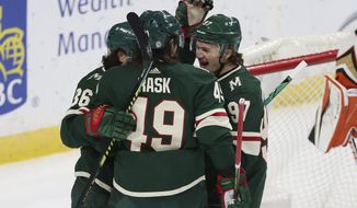 Minnesota Wild&#39;s Victor Rask (49) celebrates with teammates Mats Zuccarello (36) and Kirill Kaprizov (97) after scoring a goal against the Anaheim Ducks during the first period of an NHL hockey game Friday, May 7, 2021, in St. Paul, Minn. (AP Photo/Stacy Bengs)