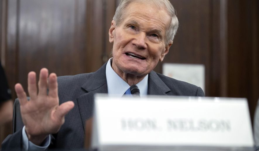 FILE - In this Wednesday, April 21, 2021 file photo, former U.S. Sen. Bill Nelson, nominee for administrator of NASA, speaks during a Senate Committee on Commerce, Science, and Transportation confirmation hearing, on Capitol Hill in Washington.  In his first news interview since becoming NASA&#39;s top official this week, Nelson told The Associated Press on Friday, May 7 that measuring the climate and diversifying the workforce are top issues. Nelson hedged on whether the U.S. can put astronauts on the moon by 2024.  (Saul Loeb/Pool via AP)