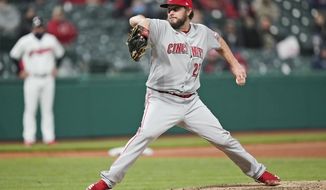Cincinnati Reds starting pitcher Wade Miley delivers in the sixth inning of a baseball game against the Cleveland Indians, Friday, May 7, 2021, in Cleveland. (AP Photo/Tony Dejak)