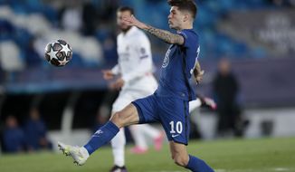 Chelsea&#39;s Christian Pulisic reaches for the ball during the Champions League semifinal first leg soccer match between Real Madrid and Chelsea at the Alfredo di Stefano stadium in Madrid, Spain, Tuesday, April 27, 2021. (AP Photo/Bernat Armangue)