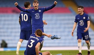 Chelsea&#39;s Timo Werner, centre, and Chelsea&#39;s Marcos Alonso, front, celebrate after winning the English Premier League soccer match between Manchester City and Chelsea at the Etihad Stadium in Manchester, Saturday, May 8, 2021.(Laurence Griffiths/Pool via AP)
