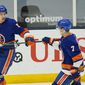 New York Islanders&#39; Mathew Barzal (13) celebrates with Jordan Eberle (7) after scoring a goal during the third period of an NHL hockey game against the New Jersey Devils Saturday, May 8, 2021, in Uniondale, N.Y. The Islanders won 5-1. (AP Photo/Frank Franklin II)