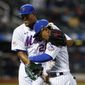 New York Mets relief pitcher Jeurys Familia (27) hugs Francisco Lindor after the top of the seventh inning against the Arizona Diamondbacks in a baseball game Saturday, May 8, 2021, in New York. (AP Photo/Noah K. Murray)