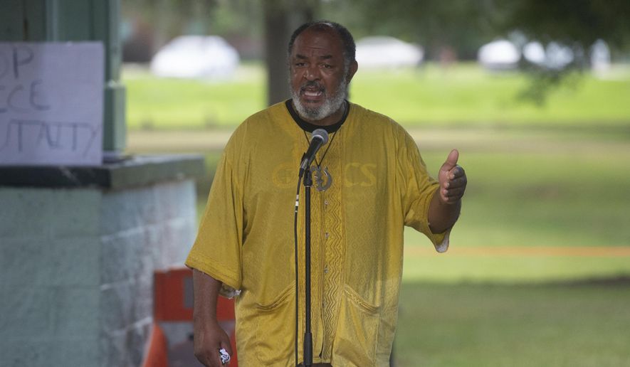 Bishop John Milton takes part in a protest march in Girard Park demanding #JusticeForGeorgeFloyd and demanding changes in local policing. Sunday, June 14, 2020 in Lafayette, La.   “We can’t look at the status of Lafayette’s segregated populations in a vacuum; we have to accept the facts of history,” said Bishop John Milton, a longtime attorney and leader of Lafayette’s Black Catholic Imani Temple.  (Scott Clause/The Daily Advertiser via AP)