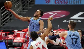 Memphis Grizzlies forward Kyle Anderson (1) puts up a shot over Toronto Raptors center Khem Birch (24) during the first half of an NBA basketball game Saturday, May 8, 2021, in Tampa, Fla. (AP Photo/Chris O&#39;Meara)