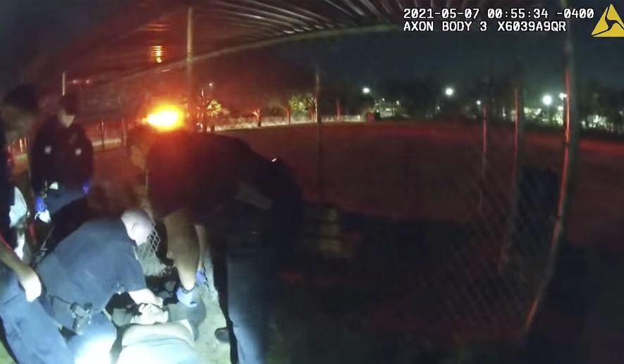 This photo taken from Providence Police body camera shows officers responding to a call Friday, May 7, 2021 of a man who was screaming outside in Providence, R.I.    State authorities are investigating the case of the man who died after being handcuffed by police. Body camera video shows they spent more than ten minutes trying to calm him down before holding him down on his stomach for about 90 seconds while cuffing him behind his back. He then appeared to collapse, and was pronounced dead at a hospital. (Providence Police Department via AP)