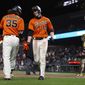 San Francisco Giants&#39; Austin Slater (13) gets a congratulatory handshake from Brandon Crawford (35) after hitting a solo home run against the San Diego Padres during the seventh inning of a baseball game Friday, May 7, 2021, in San Francisco. (AP Photo/D. Ross Cameron)