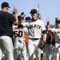 San Francisco Giants&#39; Austin Slater, middle, celebrates with teammates after the Giants defeated the San Diego Padres in a baseball game in San Francisco, Saturday, May 8, 2021. (AP Photo/Jeff Chiu)