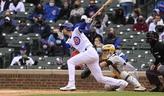 Chicago Cubs&#39; Matt Duffy (5) hits an RBI single during the seventh inning of a baseball game against the Pittsburgh Pirates, Saturday, May 8, 2021, in Chicago. (AP Photo/Matt Marton)