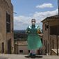 Nurse Pilar Rodríguez arrives at the small town of Buger, barely a thousand inhabitants, at the Spanish Balearic Island of Mallorca, Spain, Friday, April 23, 2021. Pilar Rodríguez, age 49, is one of three nurses in the town of Sa Pobla in the interior of the island to administer shots against COVID-19 there and in nearby villages as Buger.(AP Photo/Francisco Ubilla)