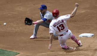 Los Angeles Dodgers second baseman Gavin Lux, left, waits for the throw before tagging out Los Angeles Angels&#39; Phil Gosselin on a steal attempt during the third inning of a baseball game in Anaheim, Calif., Sunday, May 9, 2021. (AP Photo/Alex Gallardo)
