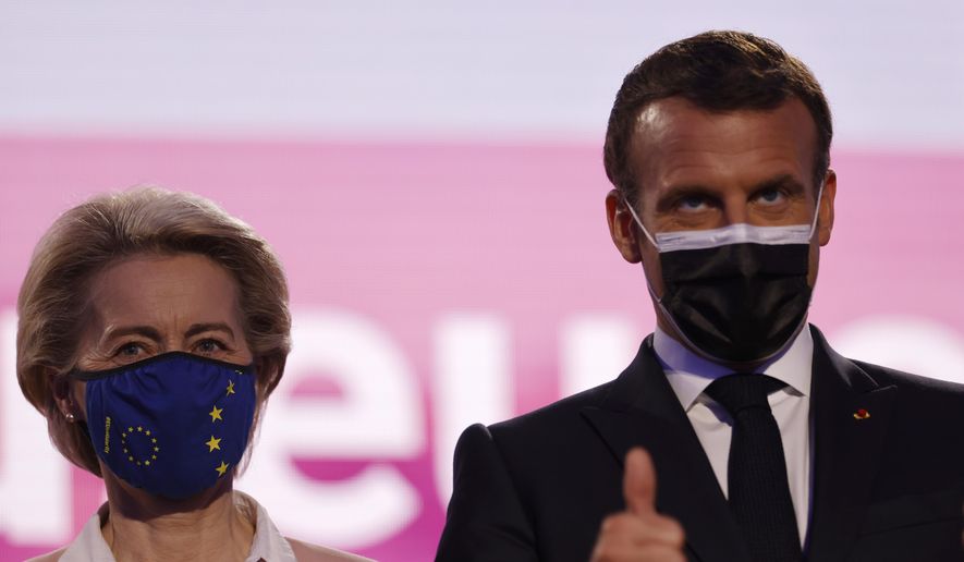 European Commission President Ursula von der Leyen and French President Emmanuel Macron attend Europe Day ceremony and the Future of Europe conference at the European Parliament in Strasbourg, eastern France, Sunday, May 9, 2021. (AP Photo/Jean-Francois Badias, Pool)