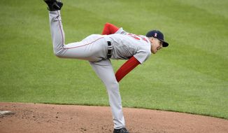 Boston Red Sox starting pitcher Nick Pivetta follows through on a pitch during the first inning of a baseball game against the Baltimore Orioles, Sunday, May 9, 2021, in Baltimore. (AP Photo/Nick Wass)