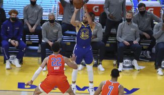 Golden State Warriors&#39; Stephen Curry, center, shoots a 3-pointer against Oklahoma City Thunder&#39;s Isaiah Roby during the first half of an NBA basketball game in San Francisco, Saturday, May 8, 2021. (AP Photo/Jed Jacobsohn)
