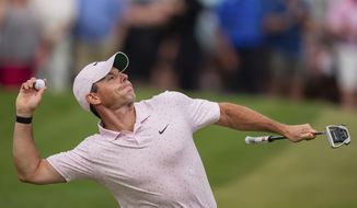 Rory McIlroy throws his ball to the crowd after winning on the 18th hole during the fourth round of the Wells Fargo Championship golf tournament at Quail Hollow on Sunday, May 9, 2021, in Charlotte, N.C. (AP Photo/Jacob Kupferman) **FILE**