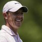 Rory McIlroy smiles after his putt on the third hole during the fourth round of the Wells Fargo Championship golf tournament at Quail Hollow on Sunday, May 9, 2021, in Charlotte, N.C. (AP Photo/Jacob Kupferman)