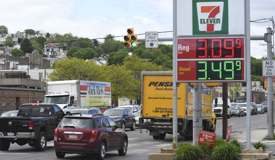 In this file photo, traffic moves along Pennsylvania Route 61 as gas prices are seen on the sign at a Sunoco gas station at East Norwegian Street in Pottsville, Pa., on Monday, May 10, 2021. (Jacqueline Dormer/Republican-Herald via AP)