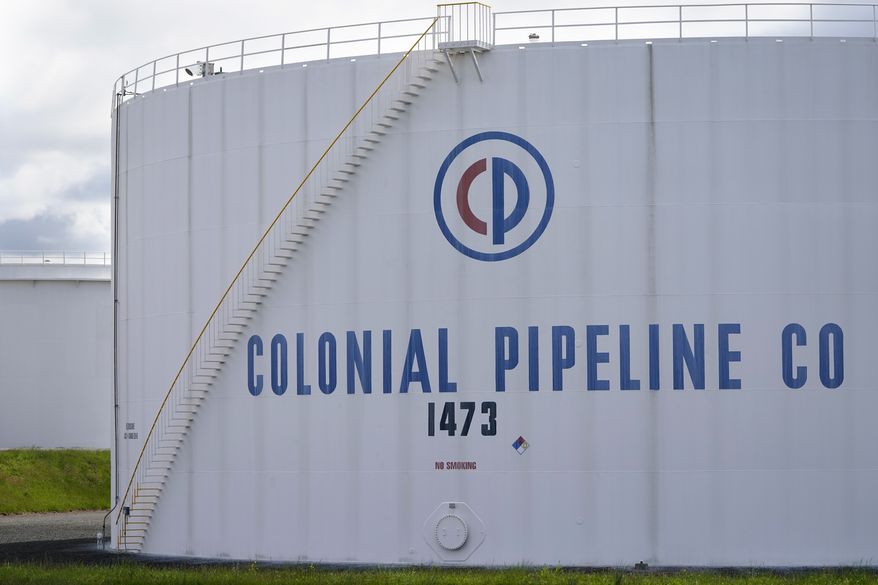 Colonial Pipeline storage tanks are seen in Woodbridge, N.J., Monday, May 10, 2021. Gasoline futures are ticking higher following a cyberextortion attempt on the Colonial Pipeline, a vital U.S. pipeline that carries fuel from the Gulf Coast to the Northeast. (AP Photo/Seth Wenig)