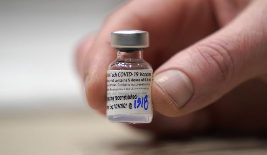 FILE - This Jan. 24, 2021, file photo shows a vial of the Pfizer vaccine for COVID-19 in Seattle. U.S. regulators on Monday, May 10, 2021, expanded use of Pfizer&#x27;s shot to those as young as 12, sparking a race to protect middle and high school students before they head back to class in the fall. (AP Photo/Ted S. Warren, File)