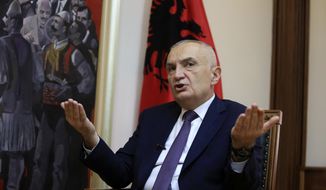 Albanian President Ilir Meta speaks during an interview with the Associated Press in Tirana, Albania, Wednesday, April 21, 2021. Albania’s president waded deep into the country&#39;s parliamentary election campaign Wednesday, accusing the left-wing government of running a “kleptocratic regime” and bungling its pandemic response. In an interview with The Associated Press, Ilir Meta also said he would step down if Prime Minister Edi Rama&#39;s Socialists — who are leading the main opposition conservatives in opinion polls — win Sunday&#39;s vote. (AP Photo/Hektor Pustina)