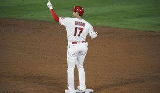 Los Angeles Angels&#x27; Shohei Ohtani, of Japan, celebrates his RBI double during the sixth inning of a baseball game against the Los Angeles Dodgers, Friday, May 7, 2021, in Anaheim, Calif. (AP Photo/Jae C. Hong)