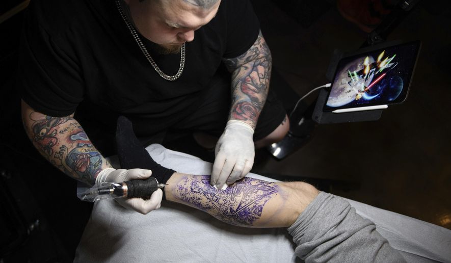 North Carolina tattoo artist amasses large TikTok following - Washington  Times
