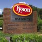 In this July 30, 2001, file photo, a sign marks the entrance to Tyson Foods headquarters in Springdale, Ark. (AP Photo/April L. Brown, File)