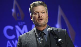 FILE - In this Nov. 13, 2019, file photo, singer Blake Shelton speaks in the press room after winning single of the year award for &amp;quot;God&#39;s Country&amp;quot; at the 53rd annual CMA Awards at Bridgestone Arena in Nashville, Tenn. The CMA will provide 4 million meals in cities with large populations of musicians and music industry professionals in partnership with Feeding America, and will also launch a donation challenge to fund  additional meals through its MICS Covid-19 initiative Monday, May 10, 2021. Shelton said he is proud to be part of the initiative and drumming up more support to raise funds for the food banks. (Photo by Evan Agostini/Invision/AP, File)