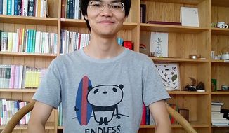 In this photo released by a friend of Cai Wei, Cai Wei poses for a photo in Beijing in June, 2018. More than a year after two young men, including Cai Wei, disappeared from their Beijing homes, they are set to be tried Tuesday, May 11, 2021 in a case that illustrates the Chinese government&#39;s growing online censorship and sensitivity to any criticism of its COVID-19 response. (Friend of Cai Wei via AP)