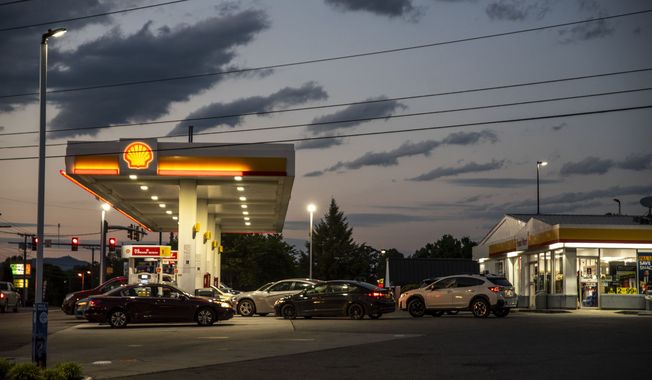 Drivers line up for fuel at a Shell Gas Station on Old Forest Road in Lynchburg, Va., Tuesday, May 11, 2021. More than 1,000 gas stations in the Southeast reported running out of fuel, primarily because of what analysts say is unwarranted panic-buying among drivers, as the shutdown of a major pipeline by hackers entered its fifth day. In response, Virginia Gov. Ralph Northam declared a state of emergency. (Kendall Warner/The News &amp; Advance via AP)
