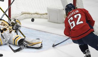 Washington Capitals left wing Carl Hagelin (62) scores a goal past Boston Bruins goaltender Jeremy Swayman (1) during the second period of an NHL hockey game, Tuesday, May 11, 2021, in Washington. (AP Photo/Nick Wass) **FILE**