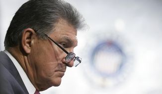 Sen. Joe Manchin, D-W.Va., listens during a Senate Appropriations committee hearing to examine domestic extremism, Wednesday, May 12, 2021 on Capitol Hill in Washington. (Alex Wong/Pool via AP)