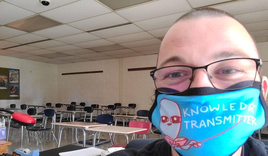 This June 2020 selfie photo shows Bill Mathis of Romeo, Mich., in one of the rooms where he taught high school English. It was his dream job, the one he referenced in a childhood journal he still keeps: “I would love to be a teacher,” he scrawled in pencil as a third grader. But stress over teaching during a pandemic put Mathis, 29, over the edge, and he resigned in November 2020. (AP Photo via Bill Mathis)