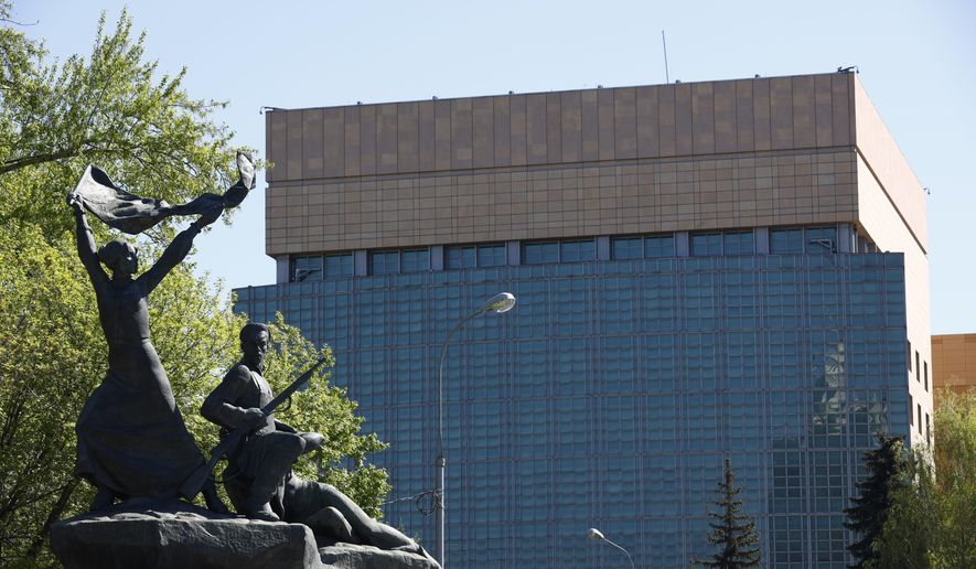 The U.S. Embassy is seen behind a monument to the Revolution workers of 1905 Revolution in Moscow, Russia, Tuesday, May 11, 2021. Under Kremlin orders, the U.S. Embassy has stopped employing Russians, leaving Russian businessmen, lovers and exchange students adrift because they can&#x27;t get visas and American parents unable to register their newborns as citizens. (AP Photo/Alexander Zemlianichenko) **FILE**