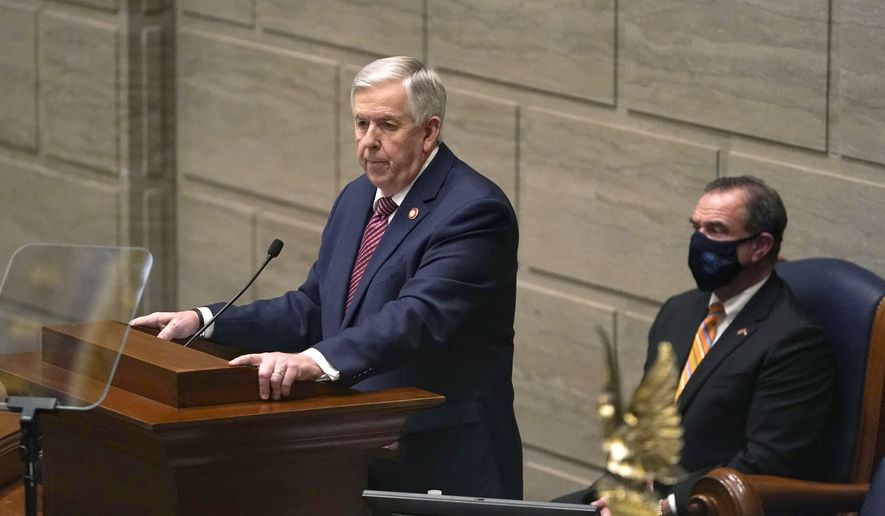 In this Jan. 27, 2021 file photo, Missouri Gov. Mike Parson delivers the State of the State address as Lt. Gov. Mike Kehoe, right, listens in Jefferson City, Mo. (AP Photo/Jeff Roberson, File)
