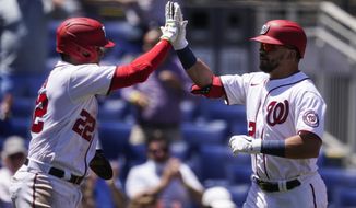 Washington Nationals&#39; Juan Soto, left, celebrates with Kyle Schwarber after Schwarber&#39;s two-run homer during the first inning of a baseball game against the Philadelphia Phillies at Nationals Park, Thursday, May 13, 2021, in Washington. (AP Photo/Alex Brandon)