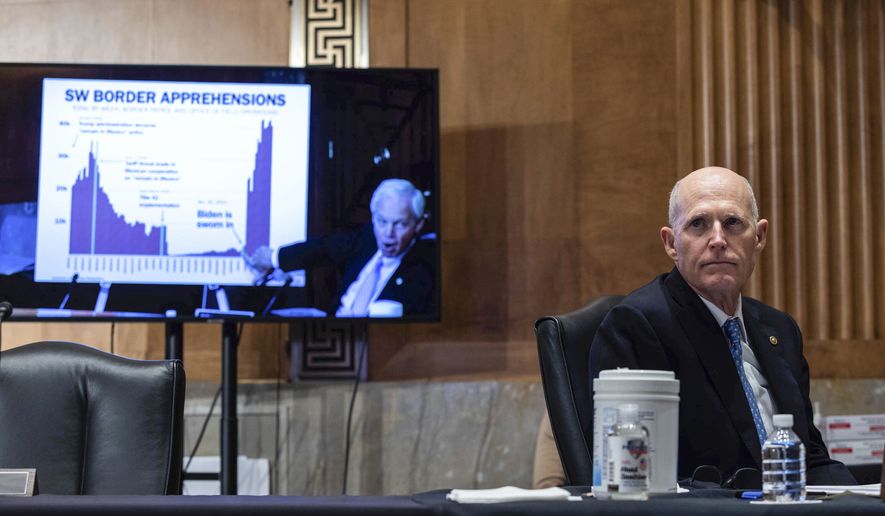 Sen. Rick Scott, R-Fla., looks on as Sen. Rob Portman, R-Ohio, speaks during a Senate Homeland Security and Government Affairs Committee hearing on Capitol Hill, in Washington, Thursday, May 13, 2021. (Graeme Jennings/Pool via AP) ** FILE **